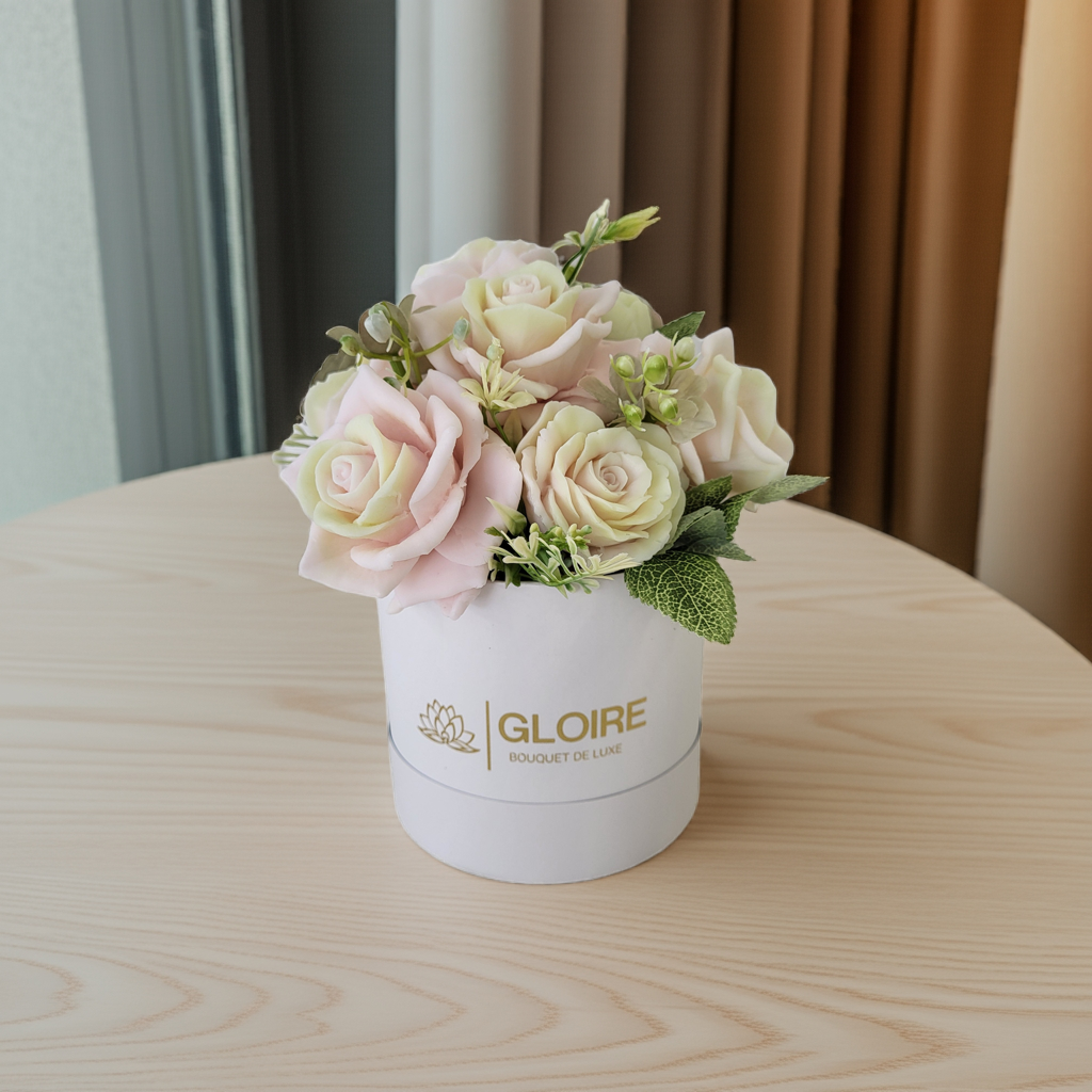 Bouquet Soleil – Scented soap flower bouquet in soft pink and yellow tones, arranged in a gift box under natural light"